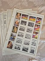 Stack of album pages showing mounted Upper Volta stamps, art themed issues visible