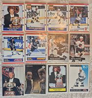 All twelve Wayne Gretzky cards arranged in three rows of four, each in its own soft sleeve
