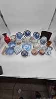 Entire assortment of Asian ceramic items arranged on white backdrop