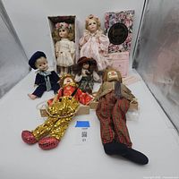 Group shot showing all dolls and two clown marionettes