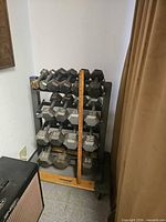 Full view of dumbbell rack loaded with weights