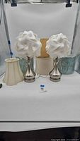 Full lot showing two table lamps and three loose shades