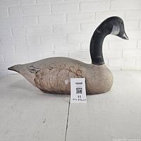 Left side view of wood Canadian goose decoy