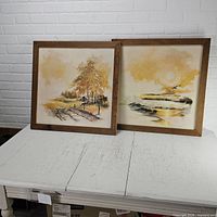 Both framed Brambaugh prints side by side