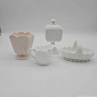 Front view of all four milk glass pieces
