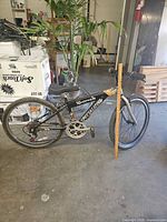 Left side full view of Specialized bike with ruler for scale