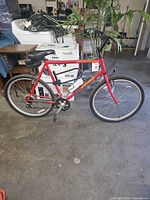 Side view of entire bicycle showing frame, wheels, drivetrain