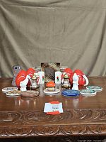 Full lot showing shakers and coasters grouped on table