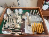 Drawer with full assortment of flatware and two rows of steak knives