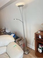 Full view of the floor lamp beside furniture