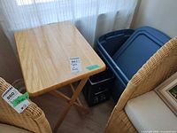 wood folding table next to tote and crate