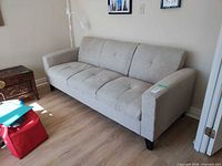 Front angled view of futon sofa showing full piece