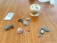 Group shot showing all jewellery pieces and birch bark trinket box