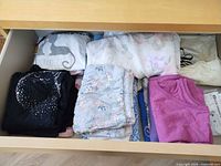Drawer with multiple folded pajama pieces