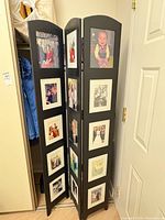 Full view of folded 3-panel wood photo frame screen