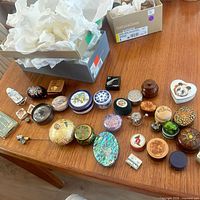 Overview of many assorted trinket boxes on table