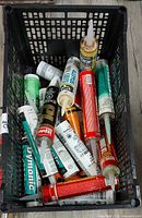 Top view of crate showing variety of caulk tubes