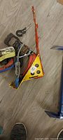 Pile of straps, yellow load bracket, hooks and rope