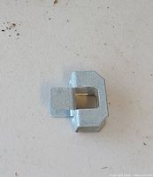 Close-up of single galvanized steel roofing clip