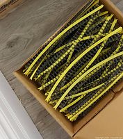 Open box showing yellow collated screw strips