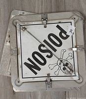 Stack of three POISON placards showing front graphic and latches
