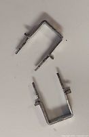 Two individual galvanized steel cable staples