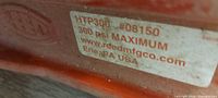 Close-up of label showing HTP300 model, 300 psi rating, Reed Manufacturing, Erie PA