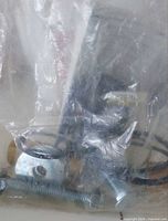 Bagged metal hardware with bolts washers O-rings