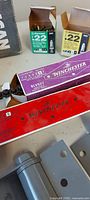 Grey spring hinges, Winchester load boxes, Ramset load boxes visible