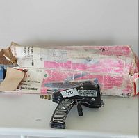 Central Pneumatic sandblaster gun with original box on table