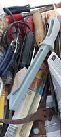 Bin containing assorted small hand tools