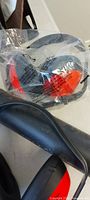 Packaged earmuff and portion of black pipe