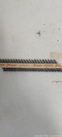 Collated nail strip marked Paslode Positive Placement