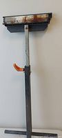 Full view of adjustable roller ball stand showing head, upright, handle and base