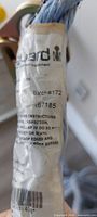 Close-up of first identification tag showing batch number