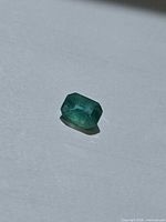 Loose octagon-cut emerald front view