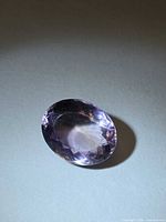 Front angle of faceted amethyst showing color and cut