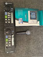 All three items: PCDJ controller panel, Harmony 1000 remote box, microphone