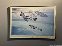 Framed print showing two Spitfires over ocean with cliffs