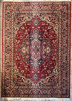 Full view of entire rug showing design, size and fringe