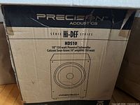 Front of sealed carton showing Precision Acoustics branding and model information