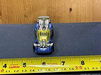 Top view showing overall design, canopy, engine detail, ruler for scale