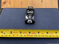 Top view showing full car and measuring tape for size
