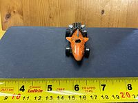 Front view showing shark nose, dorsal fin and overall length against tape measure