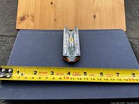 Top view of Hot Wheels Speed Slayer beside tape measure showing length
