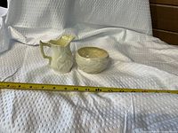 Pitcher and bowl set with tape for scale