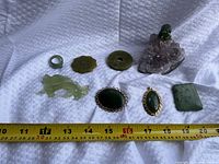 All eight items laid out with measuring tape for scale