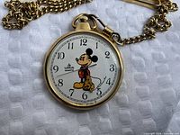 Front view of Lorus Mickey Mouse pocket watch showing dial design