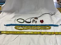 All items laid out with tape measure for scale