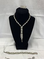 Full set on display bust – Y-drop necklace, bracelet, earrings, choker